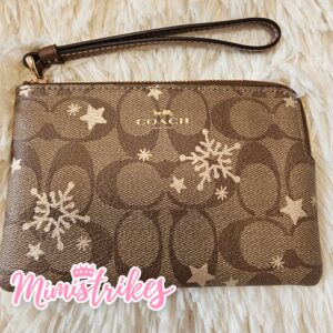 Wristlet Coach estrellas doradas